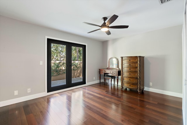 interior space featuring ceiling fan, french doors, baseboards, and wood finished floors