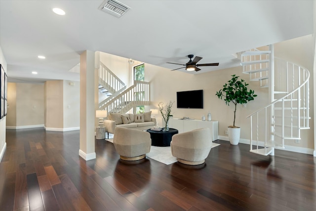 living area featuring stairs, wood finished floors, visible vents, and baseboards