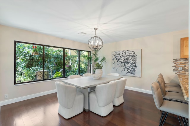 dining space with visible vents, a notable chandelier, baseboards, and dark wood-style flooring