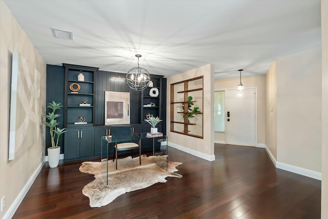 sitting room featuring visible vents, built in shelves, baseboards, dark wood-style floors, and a notable chandelier