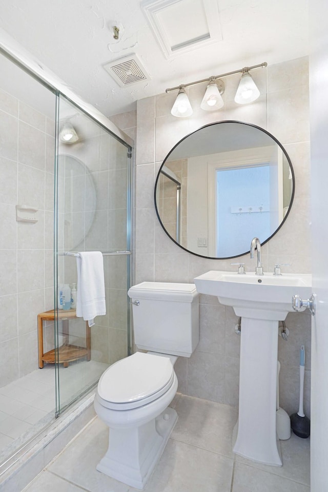235 Sunrise Ave Unit 3225, Palm Beach, FL 33480 - bathroom with tile walls, tile patterned floors, and a shower stall