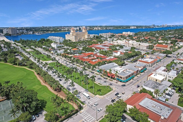 bird's eye view featuring a water view, a city view, and golf course view