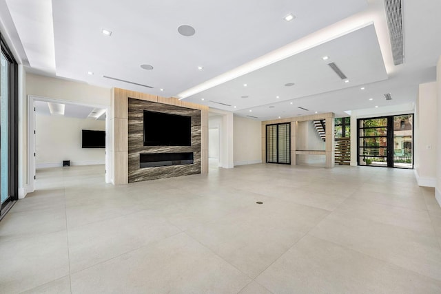 191 W Coconut Palm Rd, Boca Raton, FL 33432 - unfurnished living room featuring baseboards, a high end fireplace, and recessed lighting