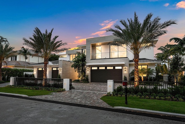 191 W Coconut Palm Rd, Boca Raton, FL 33432 - contemporary house featuring an attached garage, decorative driveway, and stucco siding