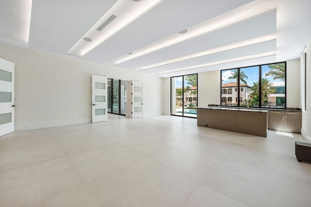 191 W Coconut Palm Rd, Boca Raton, FL 33432 - empty room with baseboards and light tile patterned floors