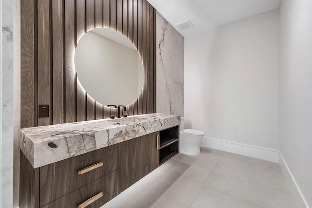 191 W Coconut Palm Rd, Boca Raton, FL 33432 - half bath featuring vanity, toilet, tile patterned floors, and baseboards