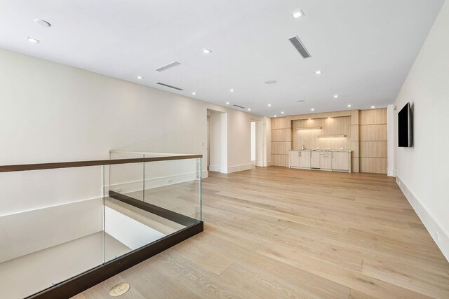 191 W Coconut Palm Rd, Boca Raton, FL 33432 - unfurnished living room featuring light wood-style floors, baseboards, and recessed lighting