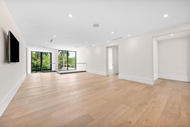 191 W Coconut Palm Rd, Boca Raton, FL 33432 - spare room featuring light wood finished floors, recessed lighting, and baseboards