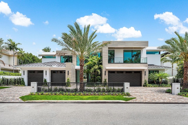 191 W Coconut Palm Rd, Boca Raton, FL 33432 - contemporary home featuring a standing seam roof, decorative driveway, and metal roof