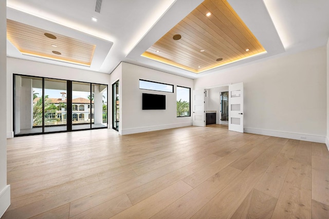 191 W Coconut Palm Rd, Boca Raton, FL 33432 - unfurnished living room featuring a raised ceiling, wood ceiling, baseboards, light wood-style flooring, and recessed lighting