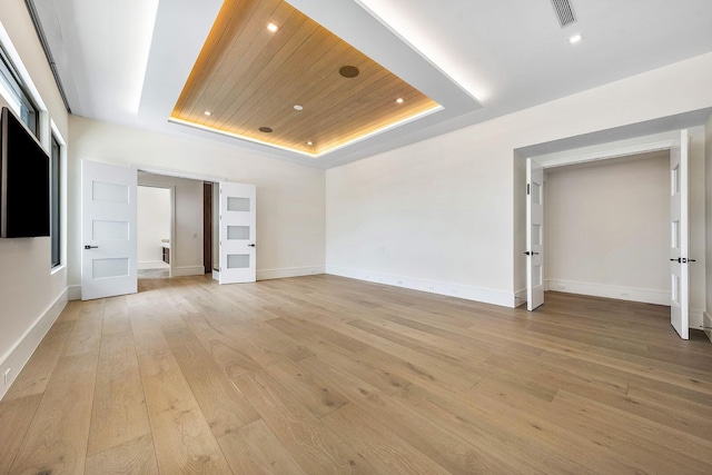 191 W Coconut Palm Rd, Boca Raton, FL 33432 - empty room with a raised ceiling, wood ceiling, light wood-style floors, recessed lighting, and baseboards
