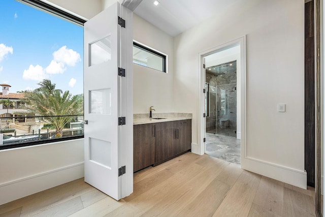 191 W Coconut Palm Rd, Boca Raton, FL 33432 - bathroom with a shower stall, wood finished floors, and vanity