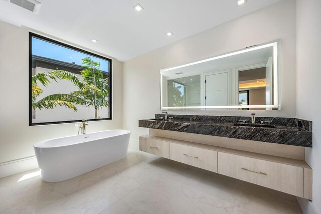 191 W Coconut Palm Rd, Boca Raton, FL 33432 - bathroom featuring marble tiled flooring, double vanity, a freestanding bath, and a stall shower