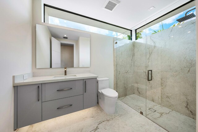 191 W Coconut Palm Rd, Boca Raton, FL 33432 - full bathroom with toilet, a marble finish shower, vanity, and plenty of natural light