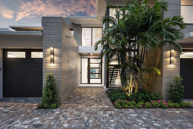 191 W Coconut Palm Rd, Boca Raton, FL 33432 - view of exterior entry at dusk