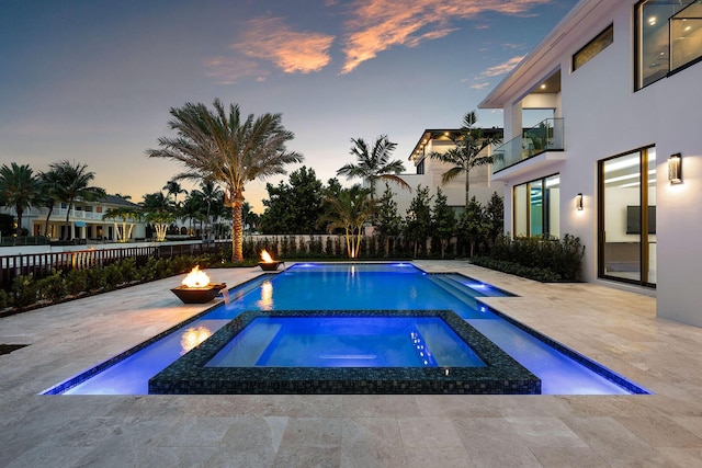 191 W Coconut Palm Rd, Boca Raton, FL 33432 - view of swimming pool with an outdoor fire pit, a patio area, a fenced backyard, and a pool with connected hot tub