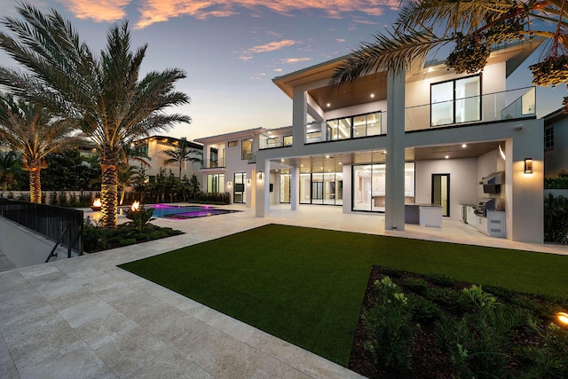 191 W Coconut Palm Rd, Boca Raton, FL 33432 - rear view of house with a balcony, area for grilling, stucco siding, and a patio