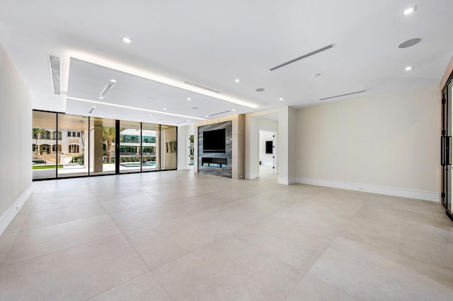191 W Coconut Palm Rd, Boca Raton, FL 33432 - unfurnished living room featuring baseboards, floor to ceiling windows, and recessed lighting