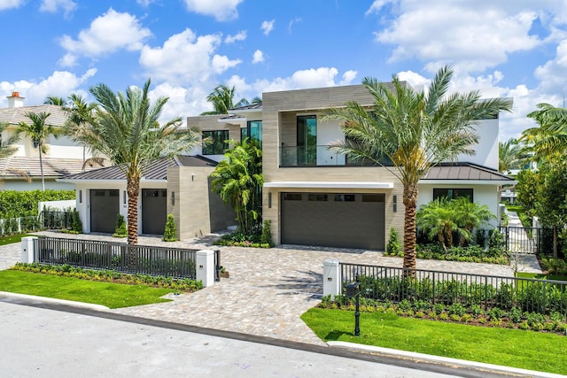 191 W Coconut Palm Rd, Boca Raton, FL 33432 - modern home featuring a fenced front yard, a standing seam roof, and an attached garage