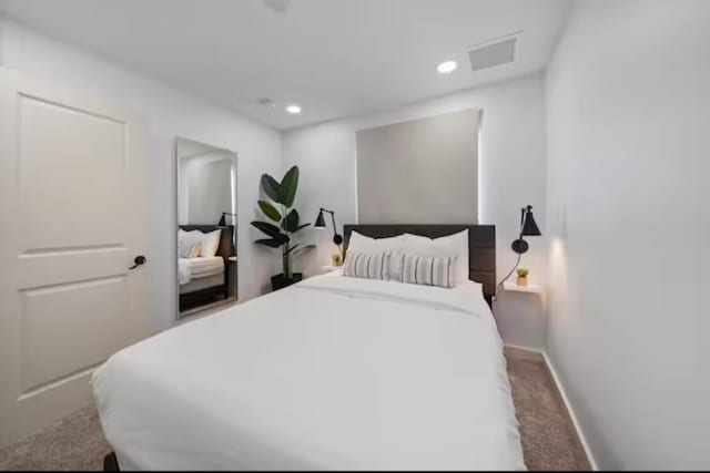 bedroom featuring baseboards, visible vents, and recessed lighting