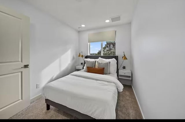 carpeted bedroom with recessed lighting, visible vents, and baseboards