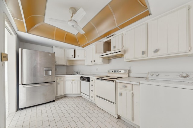 kitchen featuring ceiling fan, under cabinet range hood, washer / dryer, white appliances, and a sink