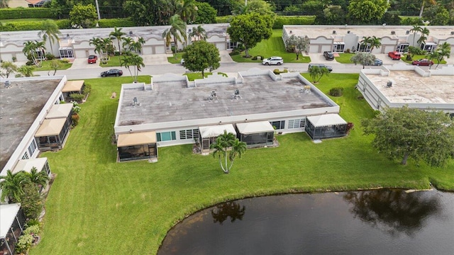 bird's eye view with a water view and a residential view