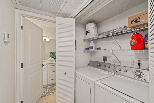 washroom featuring laundry area and washer and clothes dryer