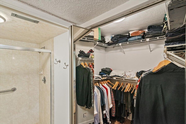 walk in closet with visible vents