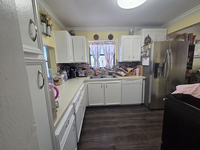 kitchen featuring white dishwasher, ornamental molding, stainless steel refrigerator with ice dispenser, and a sink