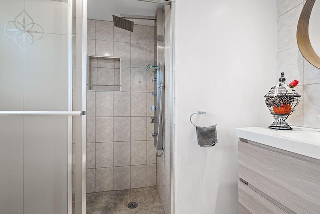 bathroom with a stall shower and vanity