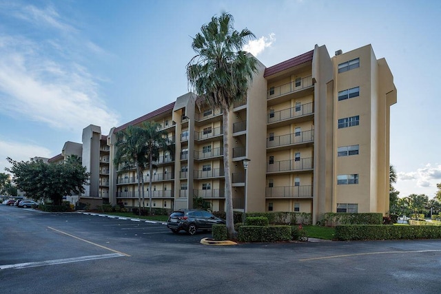 view of property with uncovered parking