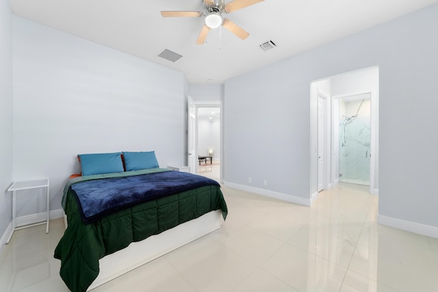 bedroom with ensuite bathroom, visible vents, and baseboards