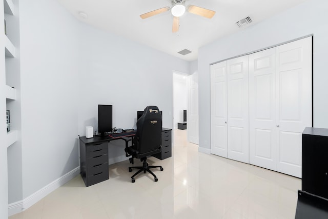 tiled office with ceiling fan, visible vents, and baseboards