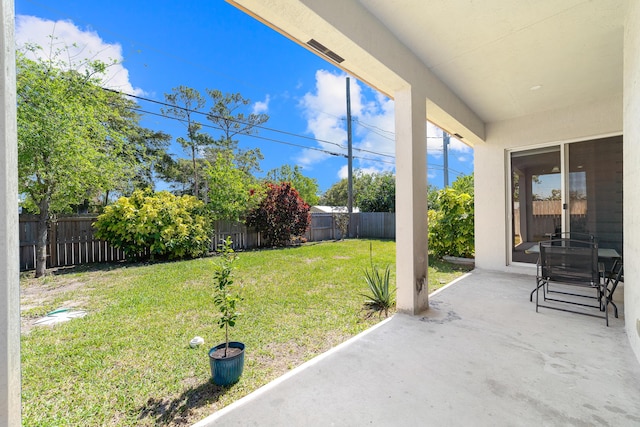 view of yard featuring a patio area and a fenced backyard