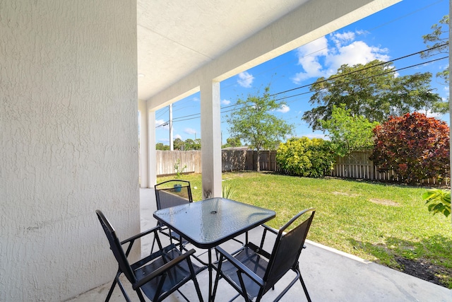 view of patio featuring a fenced backyard and outdoor dining space