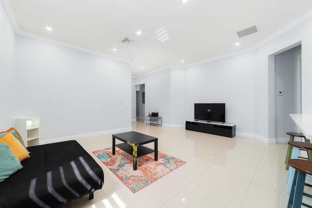 living area featuring light tile patterned floors, ornamental molding, visible vents, and baseboards