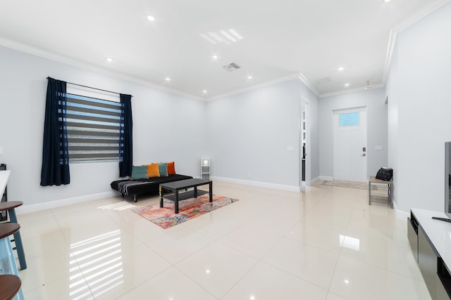 living area with light tile patterned floors, baseboards, visible vents, and crown molding