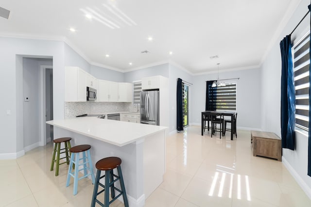 kitchen featuring stainless steel appliances, backsplash, a kitchen breakfast bar, and light tile patterned floors