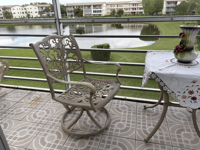 balcony featuring a water view