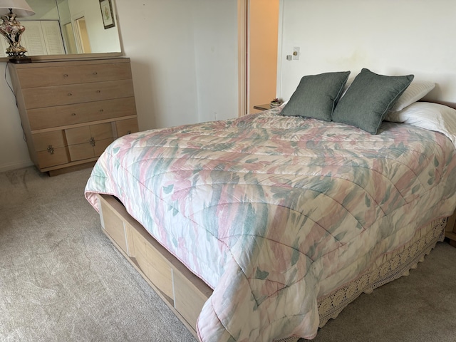 bedroom featuring light colored carpet