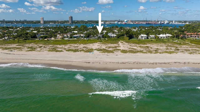 bird's eye view featuring a view of the beach and a water view