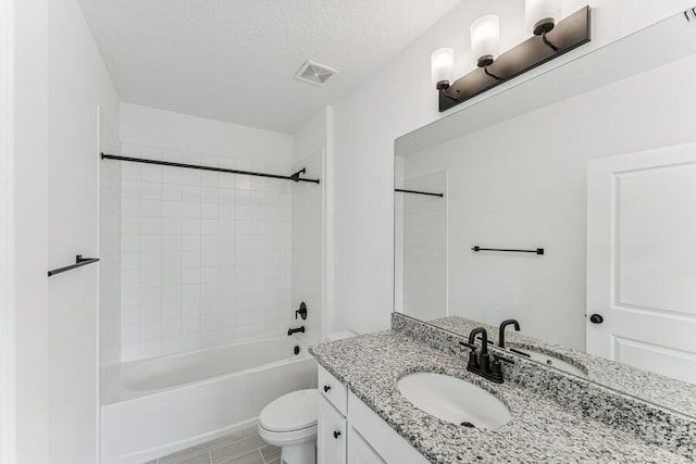 full bath with visible vents, toilet, vanity, shower / tub combination, and a textured ceiling