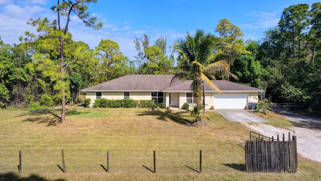 ranch-style home with a garage, a front yard, concrete driveway, and fence