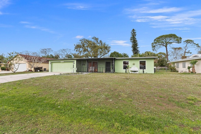 ranch-style home featuring an attached garage, a front lawn, and concrete driveway