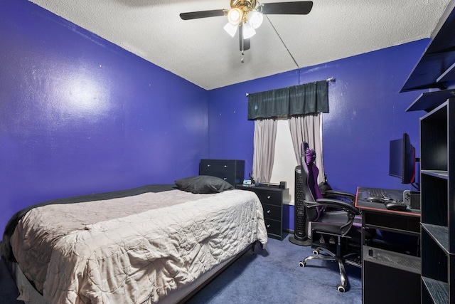 bedroom featuring a textured ceiling, carpet floors, and a ceiling fan