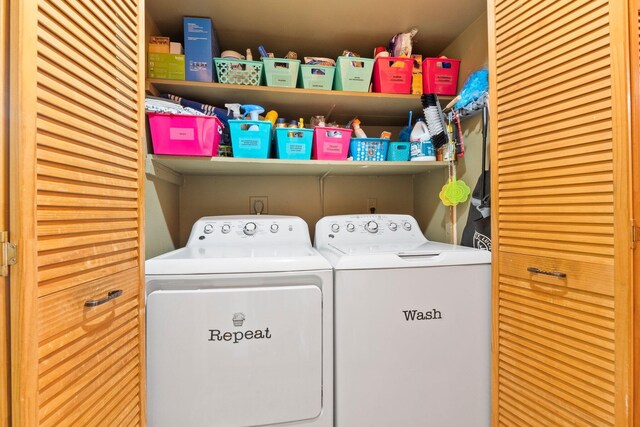 washroom featuring washing machine and dryer and laundry area