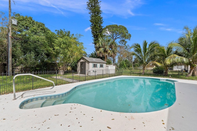 view of swimming pool featuring fence