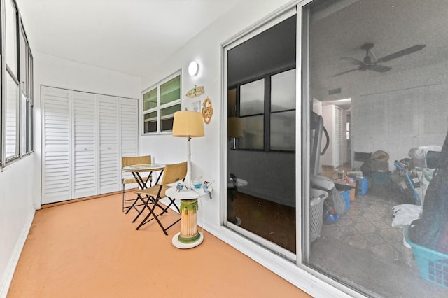 sunroom / solarium featuring a ceiling fan and visible vents