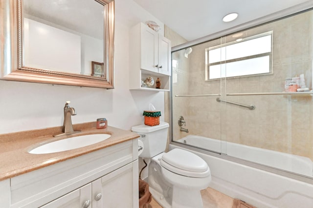 full bathroom featuring shower / bath combination with glass door, vanity, and toilet